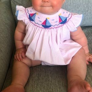 Adorable pink and white smock with embroidered sailboats